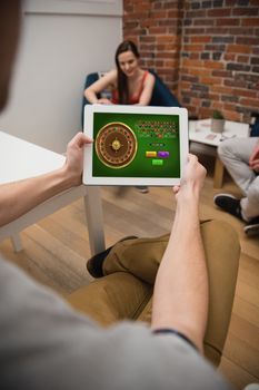Online Roulette Game  against executive using digital tablet