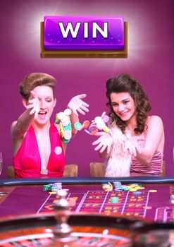 Digital composite of Win button with two women playing in casino