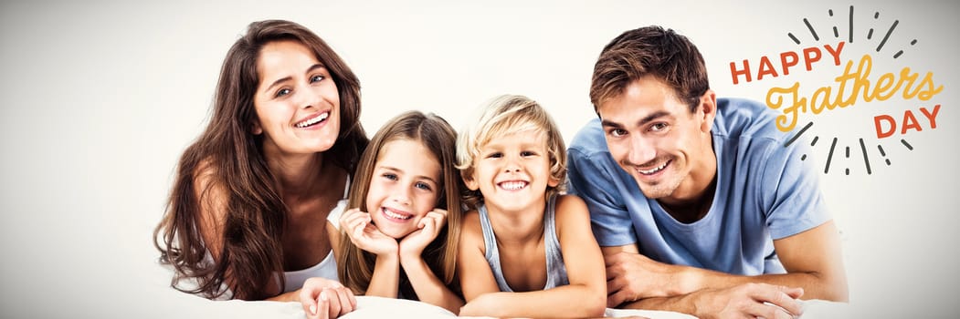 Happy family lying on a bed against close up of happy fathers day text