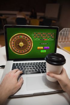 Online Roulette Game  against executive using laptop in office
