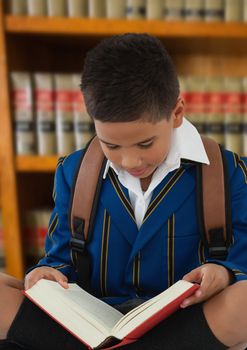 Digital composite of Boy reading in education library