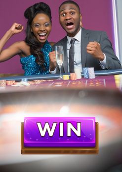 Digital composite of Win button and couple celebrating in casino