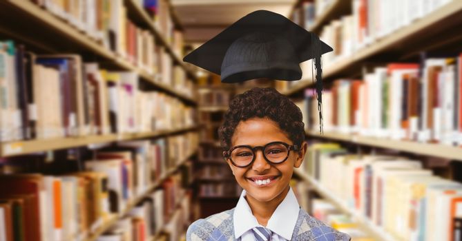 Digital composite of School boy in education library with graduation hat