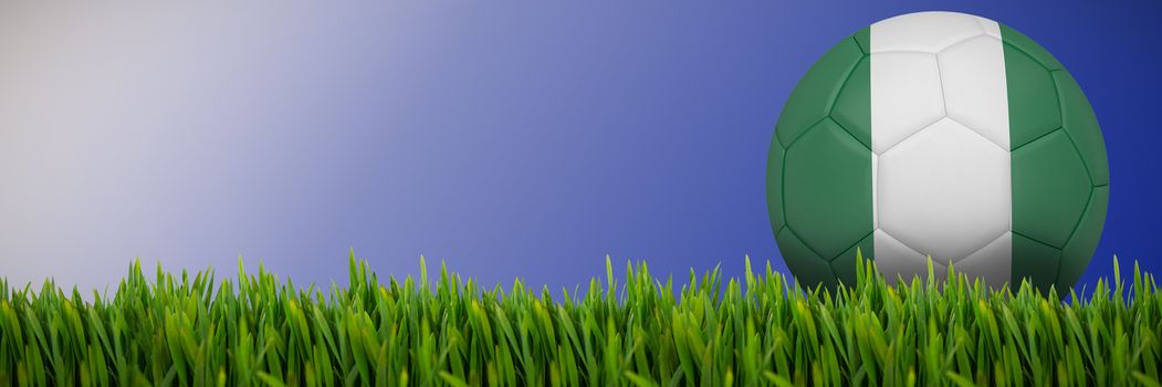 Grass growing outdoors against abstract blue background