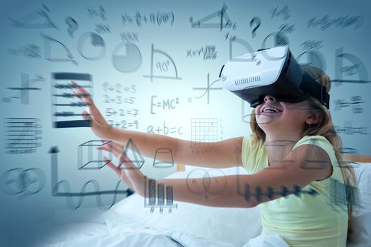 Girl wearing virtual reality simulator on bed against abstract green background,