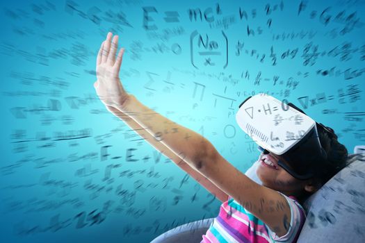 Girl wearing virtual reality simulator on couch against abstract blue background