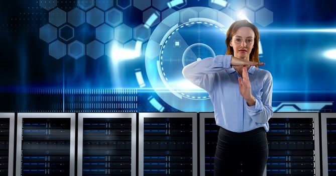 Digital composite of Woman with computer servers and technology information interface