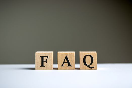 FAQ word on wooden block cubes isolated