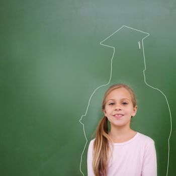 Composite image of cute pupil with graduate outline in classroom