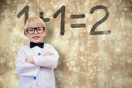 Cute pupil dressed up as teacher against paint splattered paper