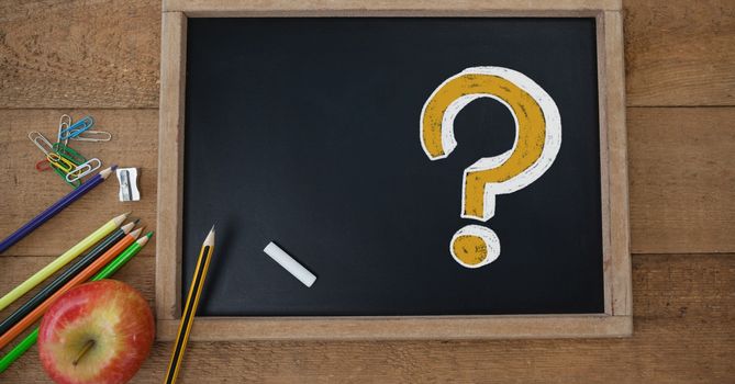Digital composite of Question Mark on education blackboard