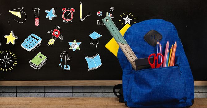 Digital composite of Schoolbag and Education drawing on blackboard for school