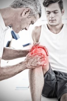 Highlighted pain against doctor examining his patient knee