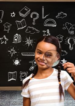 Digital composite of School girl with magnifying glass and Education drawing on blackboard for school