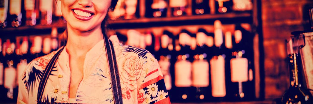Portrait of waitress taking an order on notepad in pub