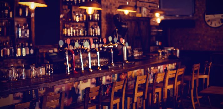 Empty chairs arranged in pub