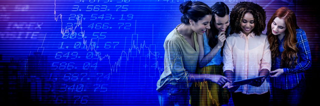 Smiling businesswomen discussing over tablet against high angle view of crowded buildings in city
