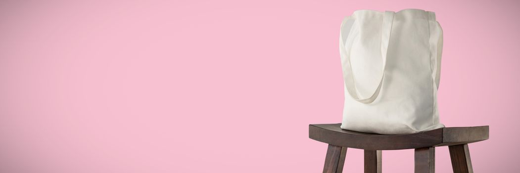 Canvas bag against pink background