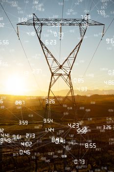 Screen with times against the evening electricity pylon silhouette
