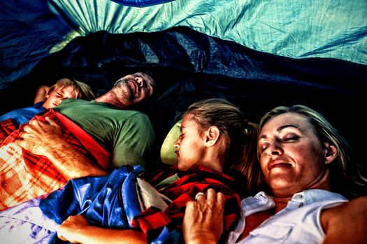 Family sleeping peacefully in the tent
