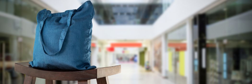 Canvas bag against interior of modern shopping mall