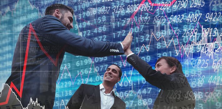 Low angle view of business people giving high five against white background against stocks and shares