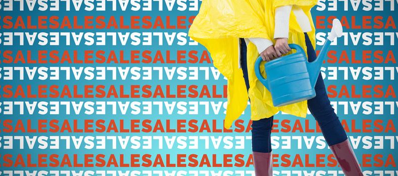 Woman in yellow raincoat holding an watering can against abstract blue background