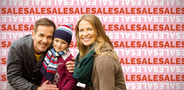  Portrait of family smiling together against pink background