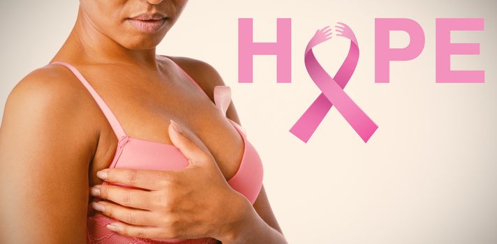 Breast cancer awareness message of hope against woman for breast cancer awareness with ribbon