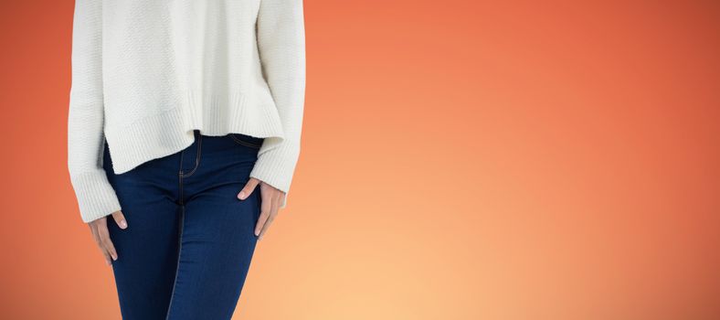 Woman in wellington boot standing with leg crossed against abstract yellow background