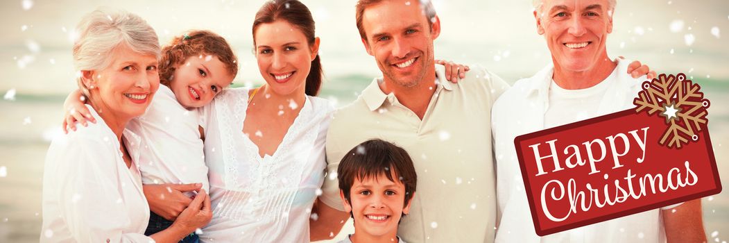 Beautiful family at the beach against greetings board