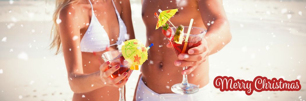 White and red greeting card against attractive young couple smiling at camera holding cocktails