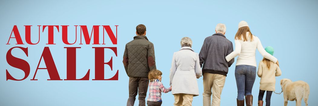 Happy family walking with their dog against blue background