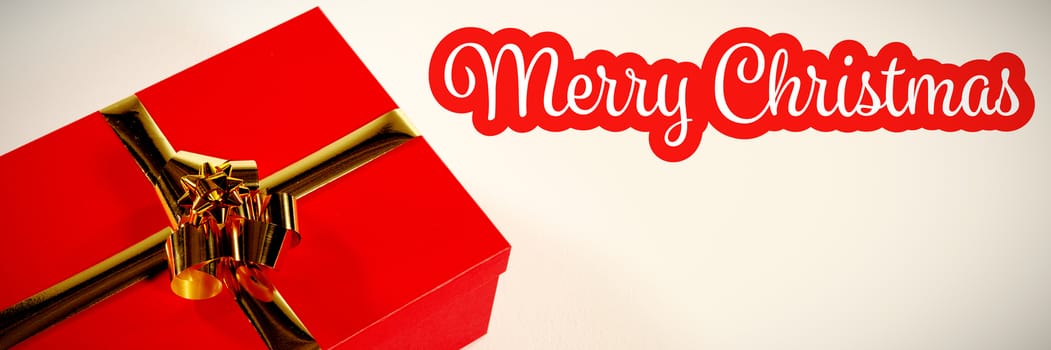 White and red greeting card against red christmas gift on white background