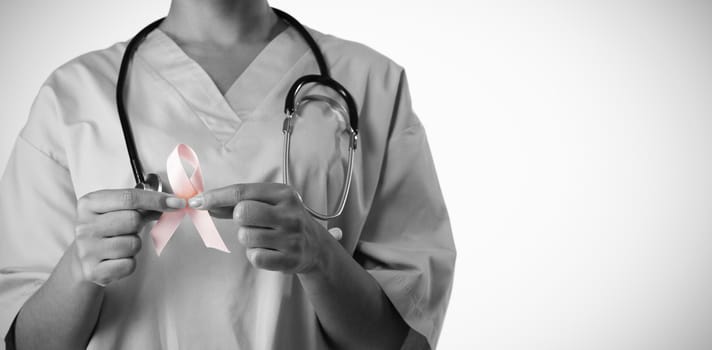 Nurse holding pink ribbon with both hands on a white background