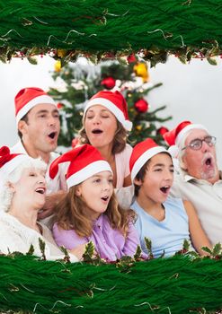 Digital composite of Family singing choral with Christmas wreath border