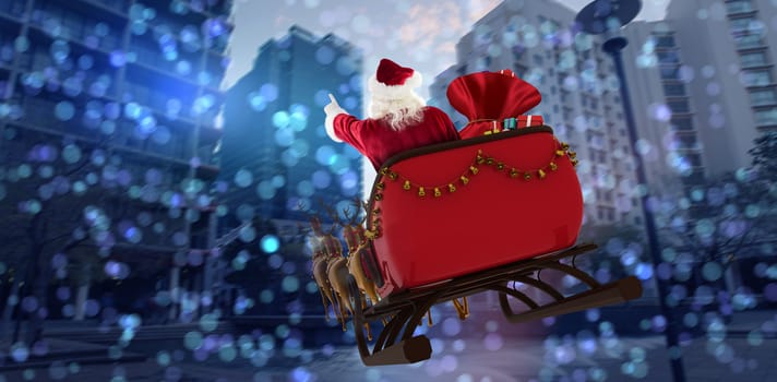 Santa Claus riding on sled with gift box against buildings against sky on sunny day