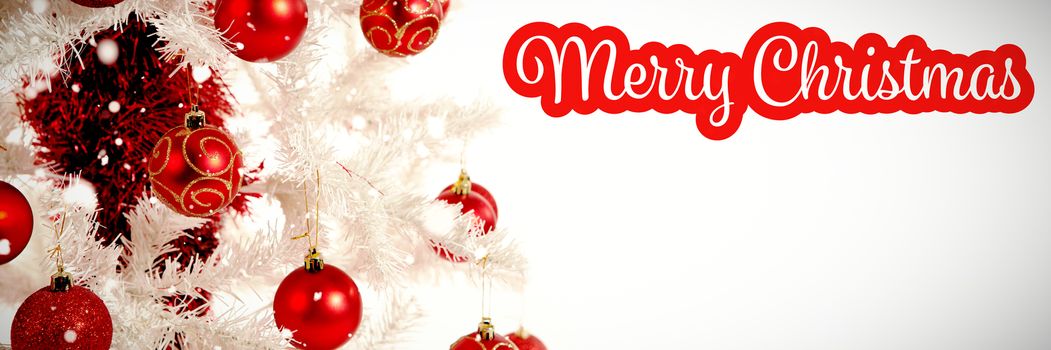 White and red greeting card against red and white christmas decorations