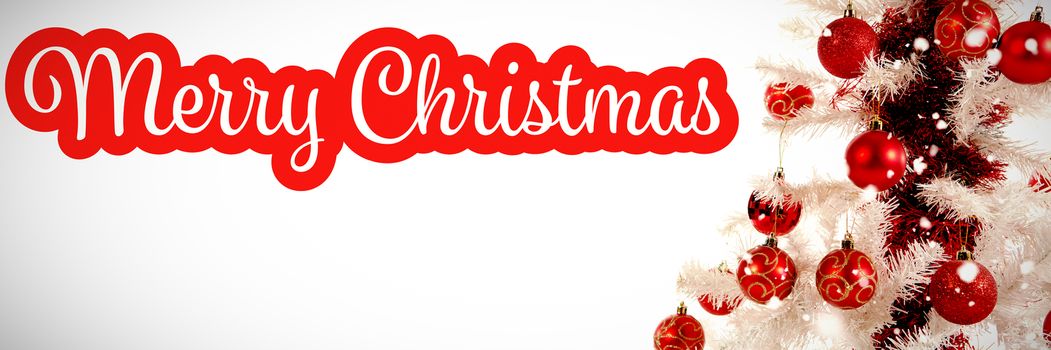 White and red greeting card against close-up of christmas tree with decoration
