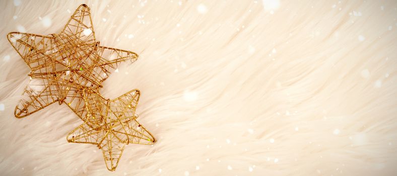 Snow falling against copy space with two stars