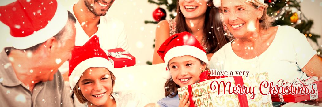 Happy family at christmas swapping gifts against christmas card