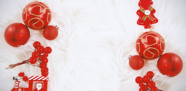 Red Christmas ornament on white fur carpet