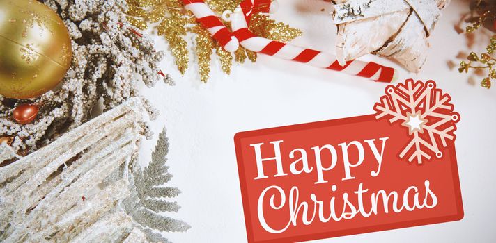 Greetings board against christmas decoration with copy space