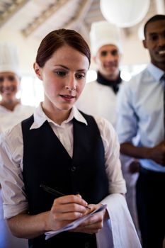 Group of hotel staffs standing together in hotel