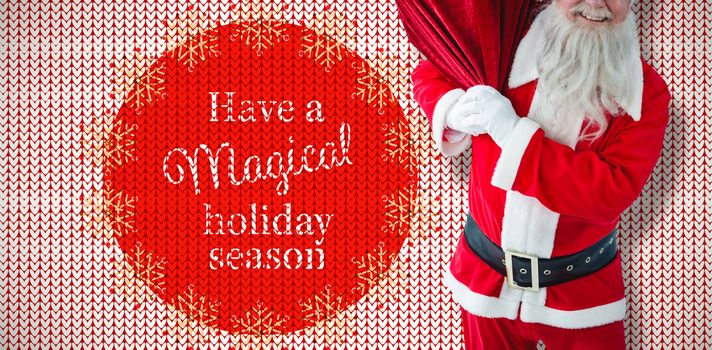 Santa Claus holding christmas bag against "have a magical holiday season" red and white pattern