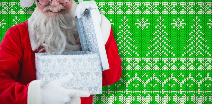 Santa Claus opening a gift box against green and white christmas pattern wallpaper