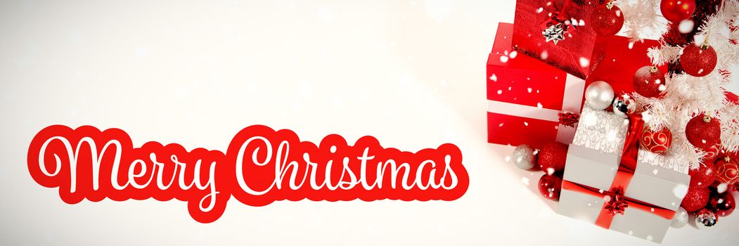 White and red greeting card against christmas gifts with copy space