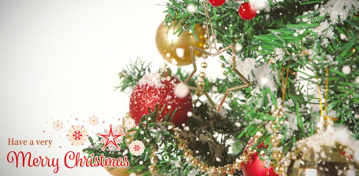 Christmas card against close-up of christmas tree with decorations