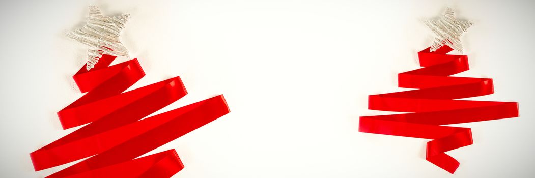 red ribbon in shape of a christmas tree on a white background