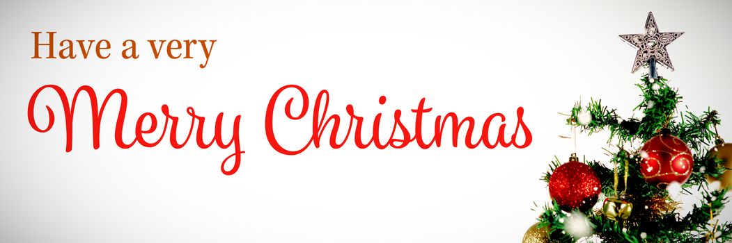 Christmas card against christmas star in tree with copy space